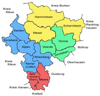 Grafik zeigt eine Karte des Kreises Wesel, in dem die Gebiete der dreizehn Standorte des Jobcenters flächenmäßig blau, grün, rot und gelb eingefärbt sind